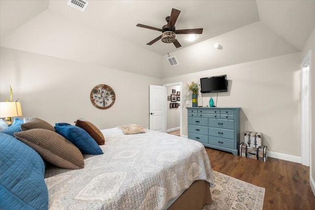 bedroom with baseboards, visible vents, wood finished floors, and lofted ceiling