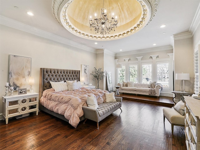 bedroom featuring a notable chandelier, dark wood-style flooring, a tray ceiling, and recessed lighting
