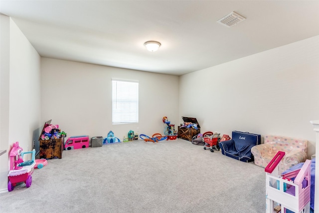 recreation room featuring visible vents and carpet