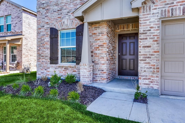 entrance to property with brick siding