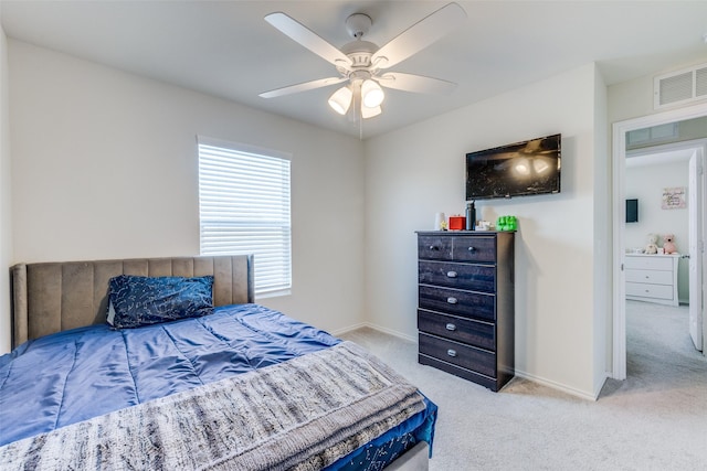 bedroom featuring visible vents, carpet flooring, baseboards, and ceiling fan