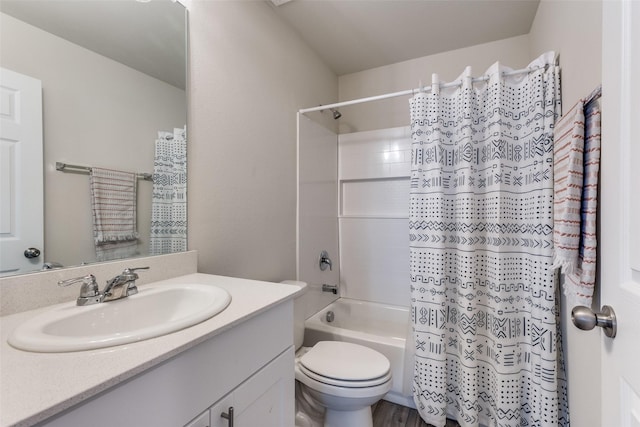 full bath featuring vanity, shower / tub combo with curtain, and toilet