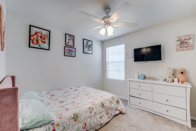 bedroom with baseboards, light carpet, and a ceiling fan