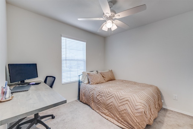carpeted bedroom with baseboards and ceiling fan