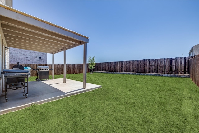 view of yard with a fenced backyard and a patio area