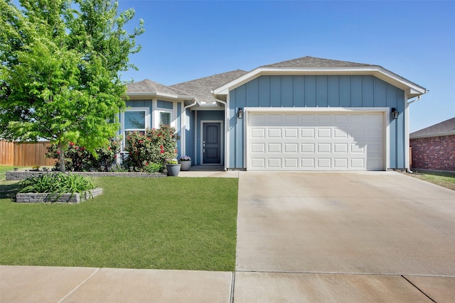 ranch-style home with driveway, roof with shingles, a front yard, fence, and an attached garage