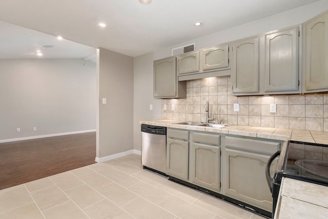 4248 Ireland Dr, The Colony, TX 75056 - kitchen with tasteful backsplash, black electric range oven, visible vents, dishwasher, and a sink