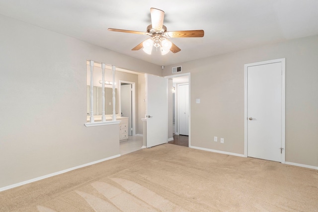 4248 Ireland Dr, The Colony, TX 75056 - unfurnished bedroom featuring ensuite bath, visible vents, baseboards, and carpet
