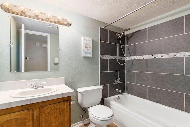 4248 Ireland Dr, The Colony, TX 75056 - full bath with washtub / shower combination, toilet, a textured wall, a textured ceiling, and vanity