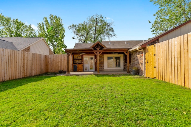 4248 Ireland Dr, The Colony, TX 75056 - view of front facade featuring a shingled roof, a ceiling fan, a fenced backyard, a patio, and a front lawn