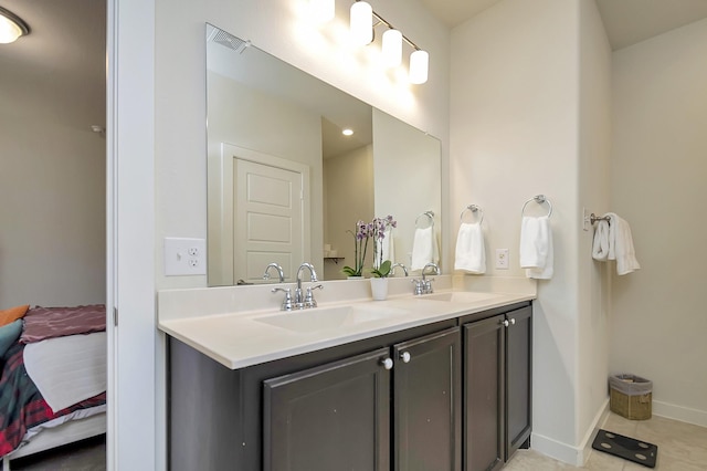 7632 Parkview Dr, Watauga, TX 76148 - full bathroom with double vanity, tile patterned flooring, and baseboards