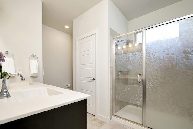 7632 Parkview Dr, Watauga, TX 76148 - full bathroom featuring tile patterned flooring, a stall shower, double vanity, and recessed lighting