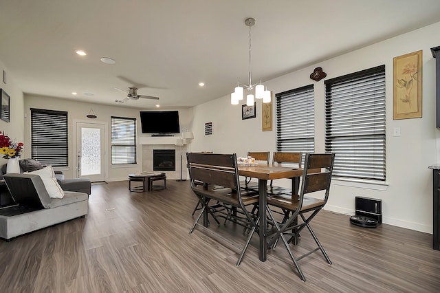 7632 Parkview Dr, Watauga, TX 76148 - dining space featuring a fireplace, wood finished floors, baseboards, and recessed lighting