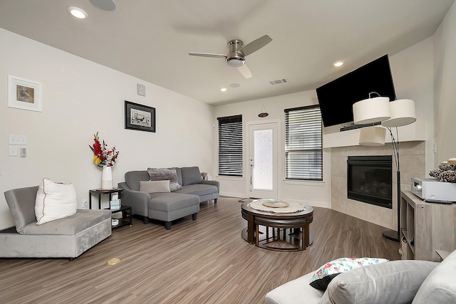7632 Parkview Dr, Watauga, TX 76148 - living area featuring a fireplace, a ceiling fan, wood finished floors, baseboards, and recessed lighting