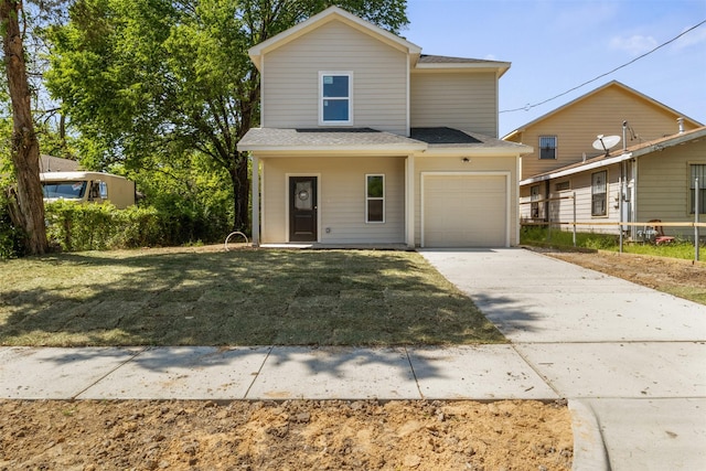 traditional home featuring a front yard, a garage, driveway, and roof with shingles