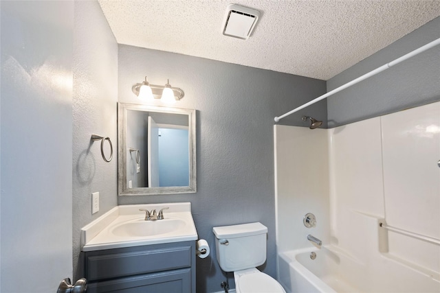 full bath featuring vanity, a textured wall, a textured ceiling, toilet, and visible vents