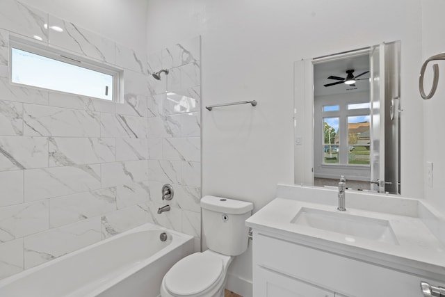 bathroom with toilet, vanity, a wealth of natural light, and tub / shower combination