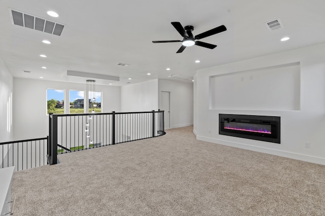 unfurnished living room with recessed lighting, carpet flooring, and visible vents