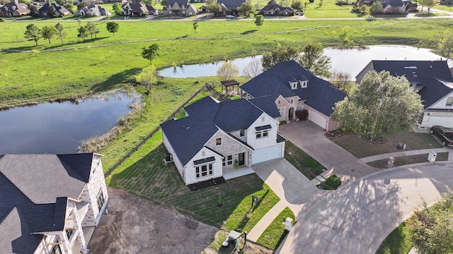 aerial view featuring a water view and a residential view