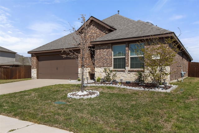 view of front of house featuring an attached garage, a shingled roof, fence, and concrete driveway