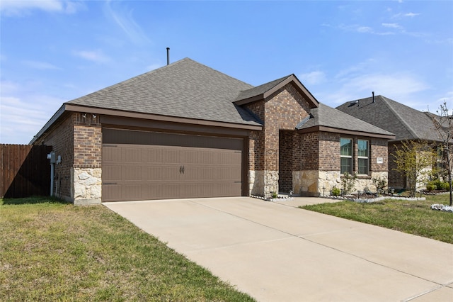 view of front of house featuring roof with shingles, fence, brick siding, a garage, and concrete driveway