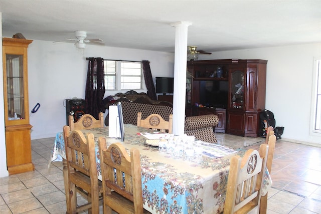 dining area with a ceiling fan, ornate columns, and light tile patterned flooring