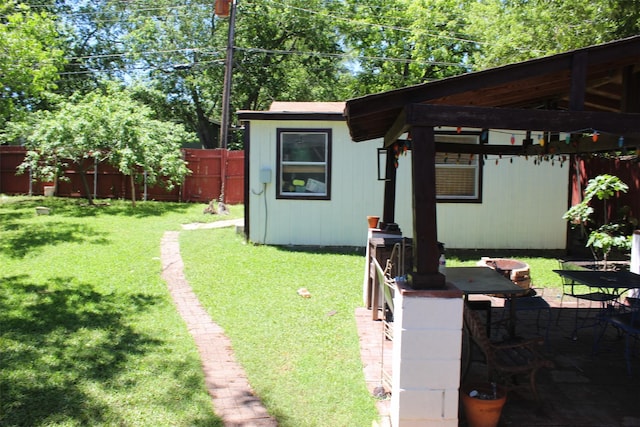 view of yard with an outbuilding and a fenced backyard