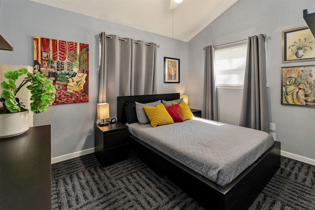 carpeted bedroom featuring ceiling fan, lofted ceiling, a textured wall, and baseboards