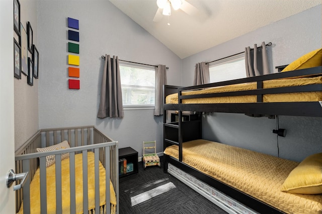 bedroom featuring lofted ceiling, a ceiling fan, and carpet