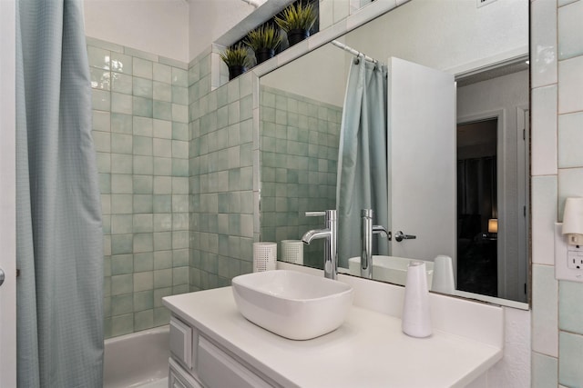 bathroom with vanity and shower / bath combination with curtain