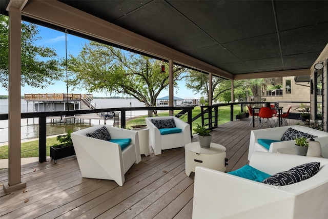 wooden terrace with outdoor dining area, outdoor lounge area, and a water view