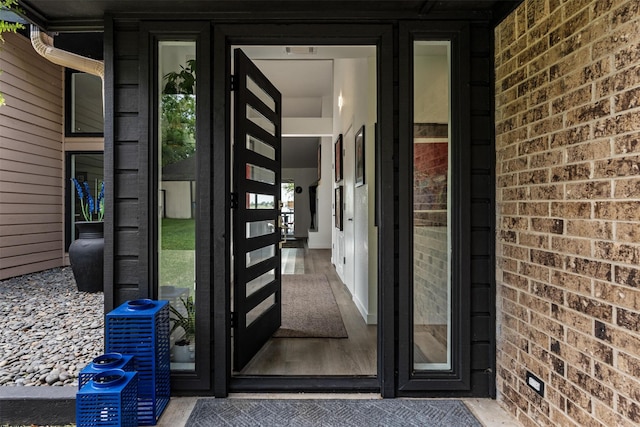 property entrance with brick siding