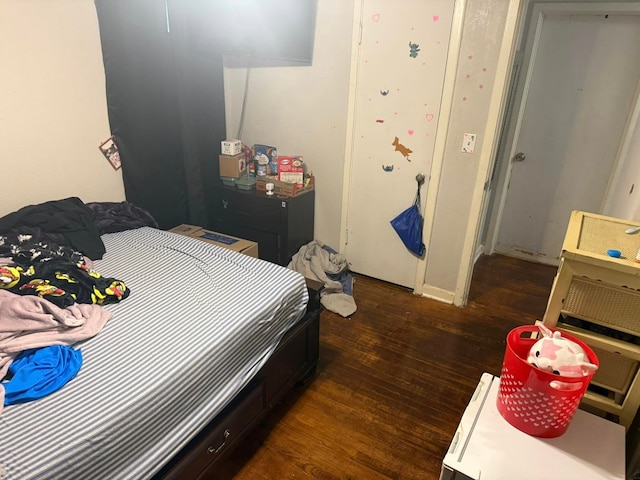 bedroom featuring wood finished floors