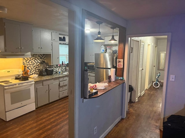 kitchen featuring backsplash, appliances with stainless steel finishes, range hood, and dark wood-style floors