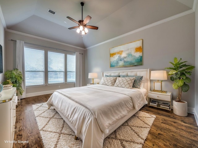 bedroom with ceiling fan, wood finished floors, baseboards, lofted ceiling, and ornamental molding