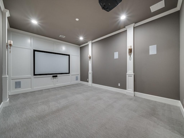 cinema room with baseboards, ornamental molding, recessed lighting, and light colored carpet