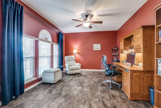home office featuring a ceiling fan, a textured ceiling, and plenty of natural light