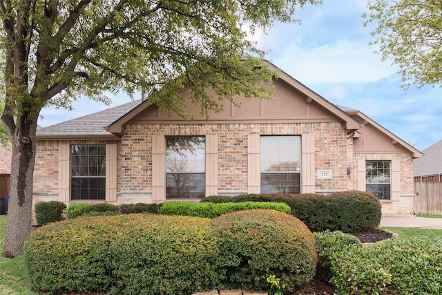 122 Trophy Trl, Forney, TX 75126 - view of front of property with brick siding, a shingled roof, and fence