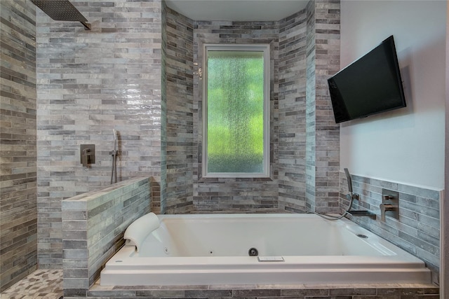 full bath with a jetted tub and walk in shower