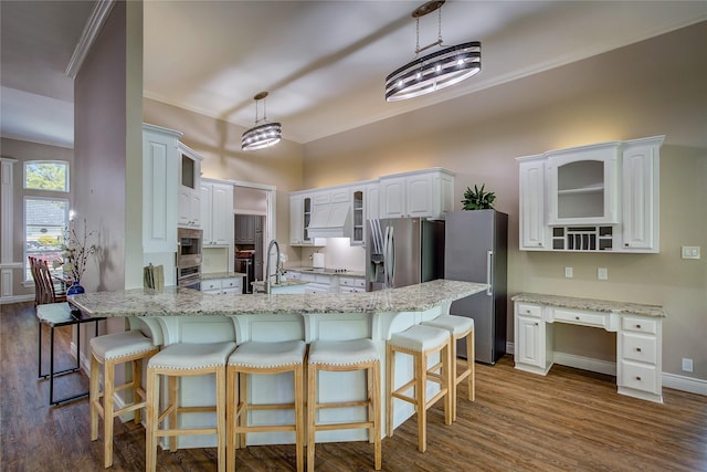 kitchen featuring crown molding, glass insert cabinets, dark wood finished floors, and stainless steel appliances