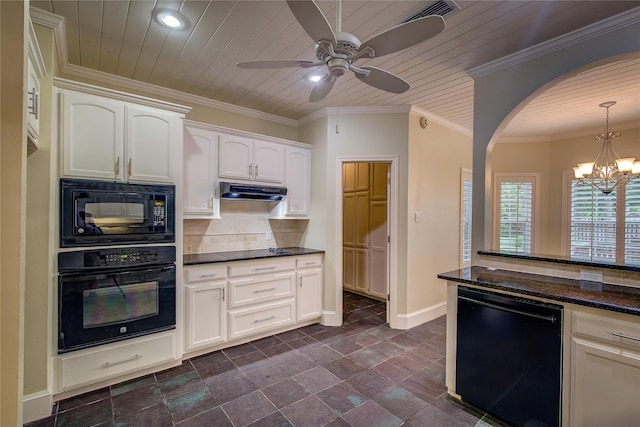 kitchen featuring baseboards, visible vents, backsplash, black appliances, and hanging light fixtures