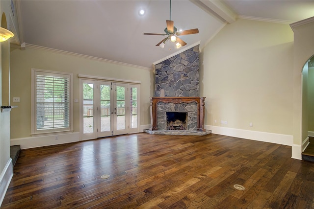 unfurnished living room featuring ceiling fan, wood-type flooring, vaulted ceiling with beams, and a fireplace