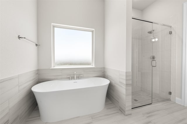 2413 Rams Horn, Waxahachie, TX 75167 - bathroom with tile walls, a freestanding tub, and a stall shower