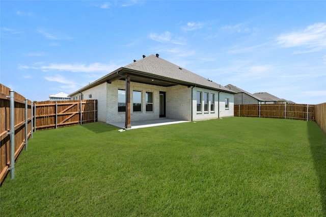 2413 Rams Horn, Waxahachie, TX 75167 - rear view of property featuring a lawn, roof with shingles, a patio area, and a fenced backyard