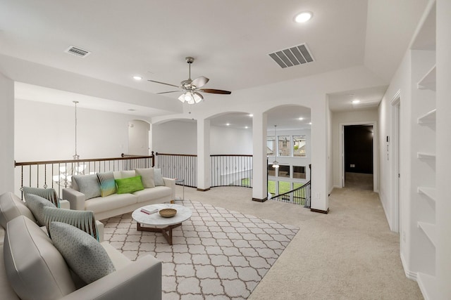 14662 Gentle Breeze Rd, Frisco, TX 75035 - living area featuring visible vents, ceiling fan, and arched walkways