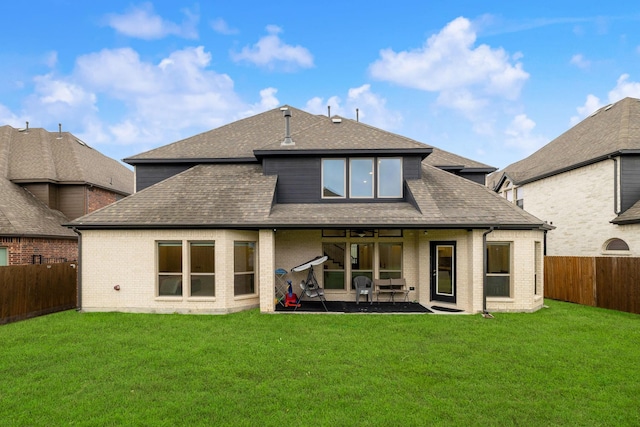 14662 Gentle Breeze Rd, Frisco, TX 75035 - back of house with a shingled roof, a fenced backyard, and a lawn