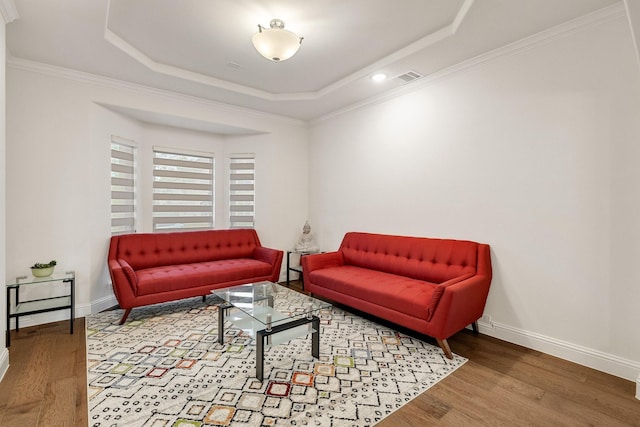 14662 Gentle Breeze Rd, Frisco, TX 75035 - living room with visible vents, a tray ceiling, baseboards, and wood finished floors