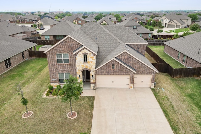 1118 Ranger Rd, Forney, TX 75126 - view of front of property featuring a garage, a residential view, brick siding, and driveway