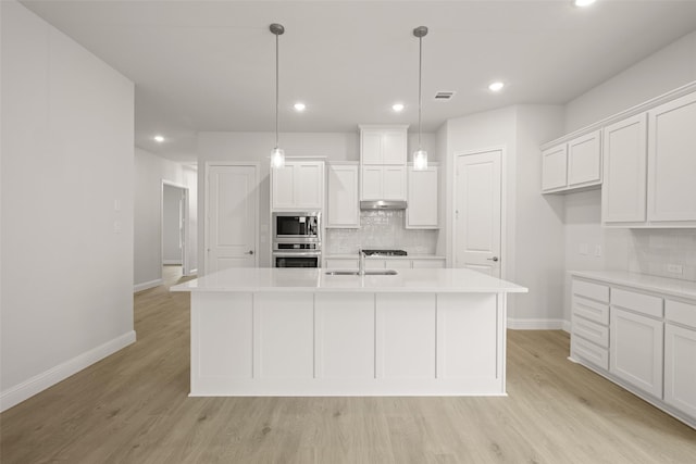 2297 High Plain Ln, Waxahachie, TX 75167 - kitchen featuring appliances with stainless steel finishes, a sink, decorative backsplash, baseboards, and white cabinets