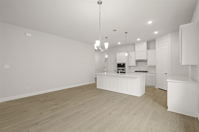 2297 High Plain Ln, Waxahachie, TX 75167 - kitchen with recessed lighting, decorative backsplash, light wood finished floors, light countertops, and stainless steel oven